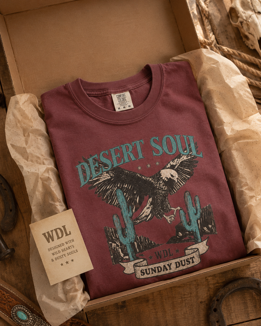 Desert Soul Cowgirl Tee packaging mockup in Brick